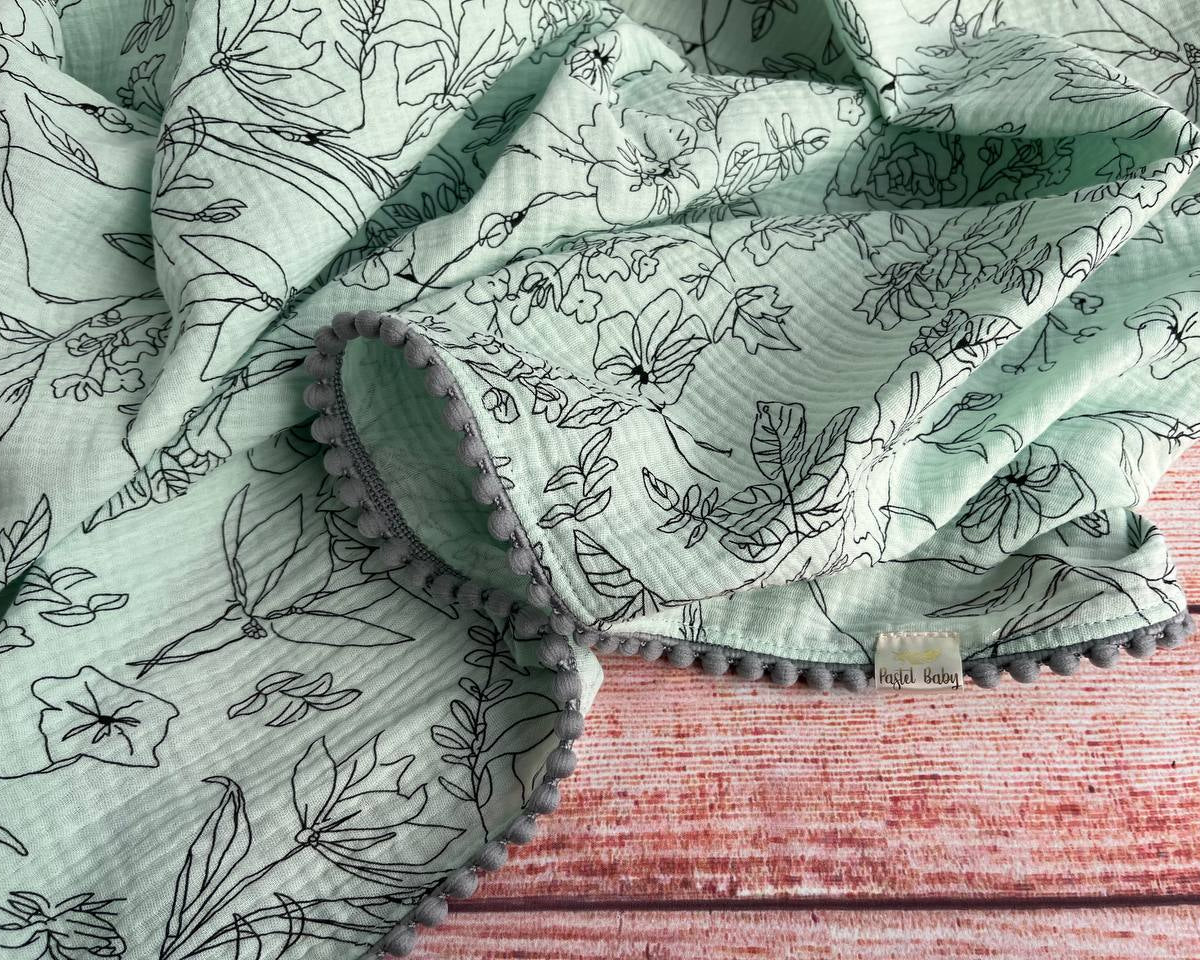 Cotton muslin Pom Pom swaddle blanket - Mint with black flowers