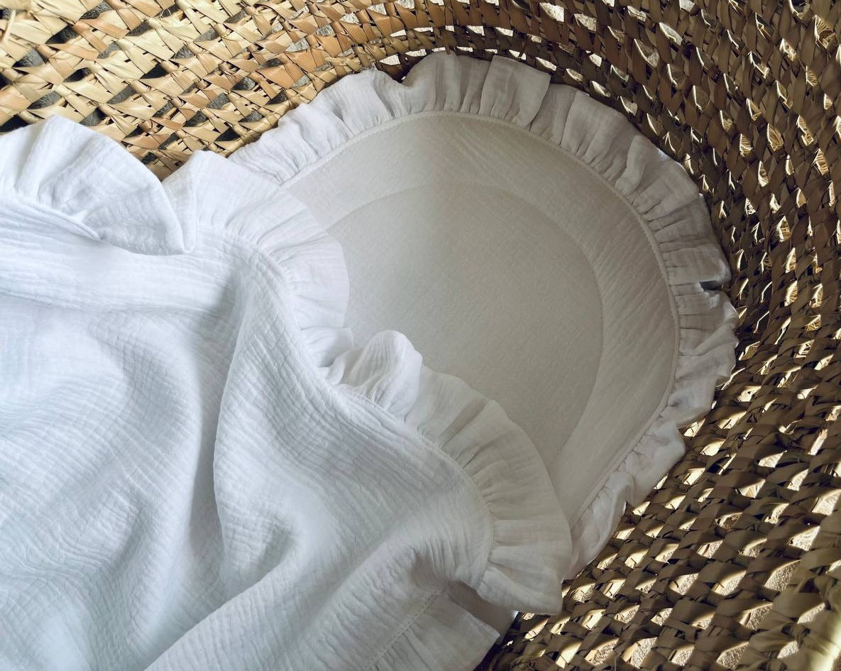 white muslin baby blanket with ruffles