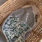 Grey hooded baby bath towel with eucalyptus print muslin 