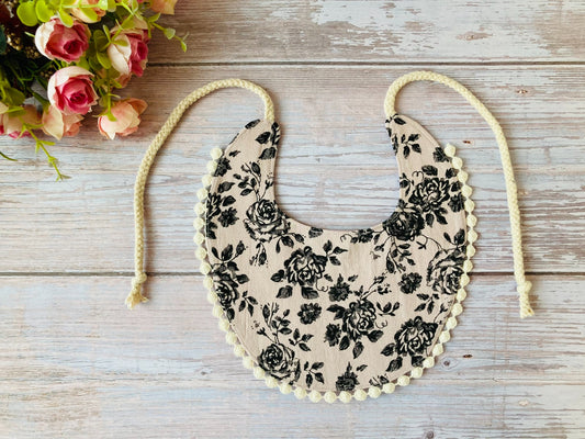 Boho baby bib in dusty pink with black roses print