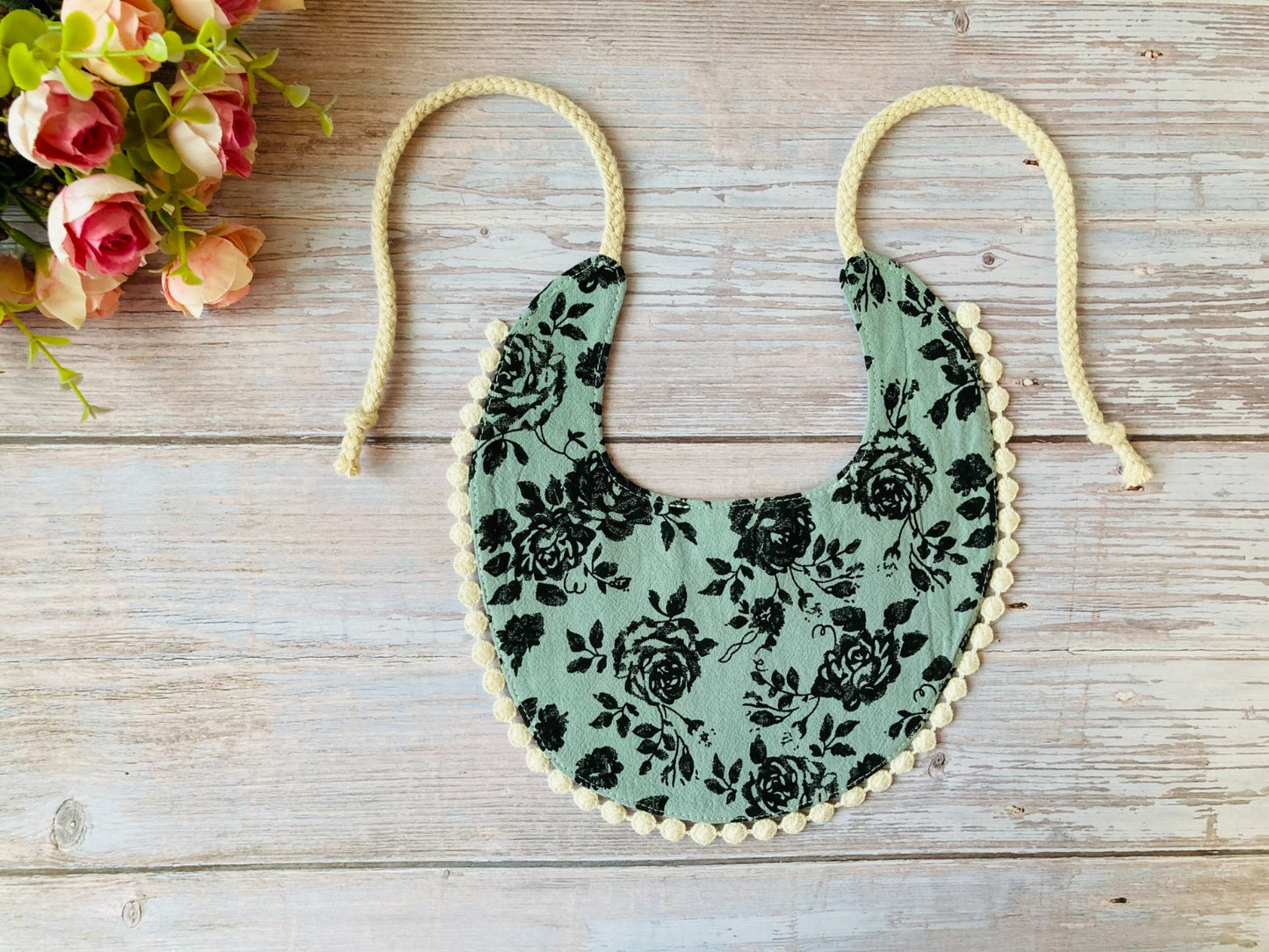 Boho baby bib in turquoise with black roses print