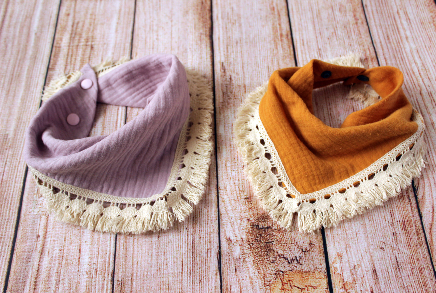 Boho baby bib with a cotton fringe trim - dusty pink