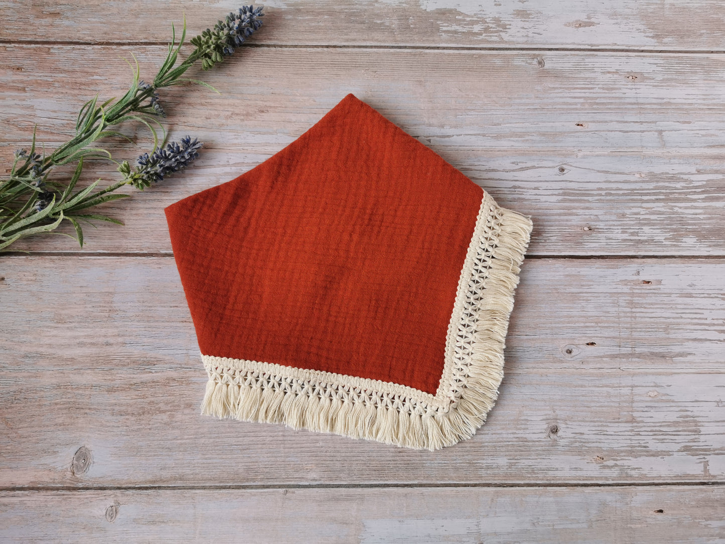 Double gauze Boho baby bib with a cotton fringe trim - ginger brown