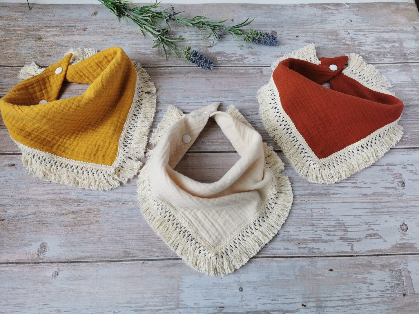 Double gauze Boho baby bib with a cotton fringe trim - ginger brown