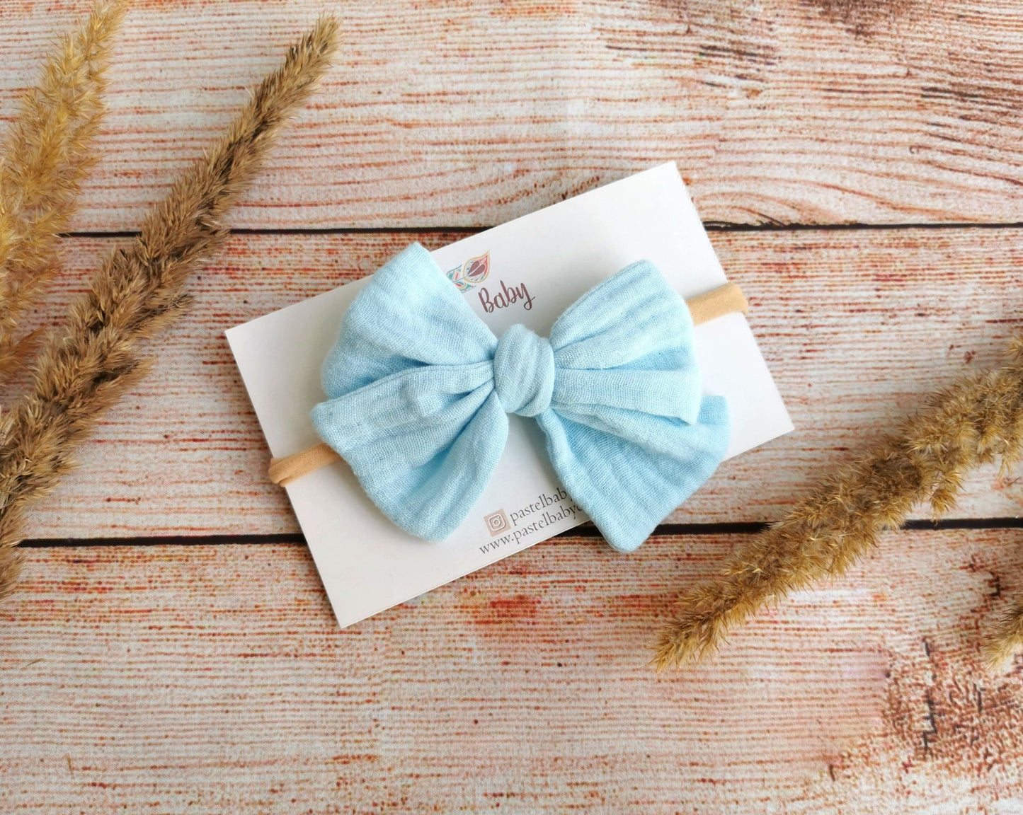 large hair bow baby headband light blue muslin